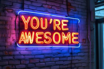 Vibrant neon sign displays the inspirational message you're awesome against a brick wall background.