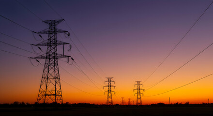 Fototapeta premium Silhouetted Power Lines Against a Beautiful Sunset Sky Landscape