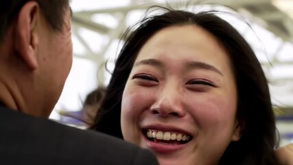 Woman expresses joy at airport reunion with loved one after long separation