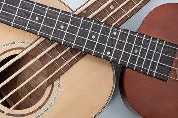 Four-string bass ukulele with wooden body and built-in tuner and pickup.