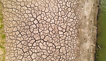 Naklejka premium Dramatic drought impact on dry riverbed natural landscape aerial view environmental effects