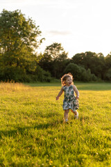 happy girl running in the park and shouting