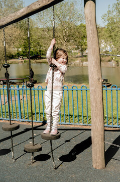 Happy little girl at playground, childhood