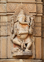 Carved sculpture of Lord Ganesha on the rear side of Shri Siddheshwara Swamy Temple, Hottal, Nanded, Maharashtra, India.