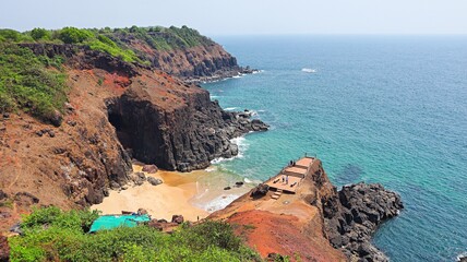 View of the rocky cliff and sunset point at Devghali, Kaseli Beach, Ratnagiri, Maharashtra, India.