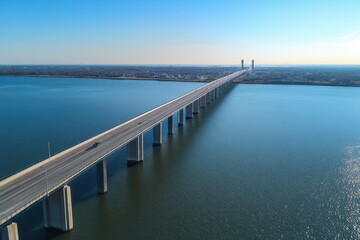 Fototapeta premium Drone captures aerial view of Delaware Memorial Bridge spanning the water, Drone orbit Delaware Memorial Bridge aerial