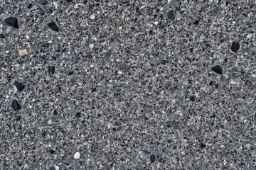 Detailed Close-Up of Grey Concrete with Stone Aggregate Texture, Suitable for Backgrounds                                                             