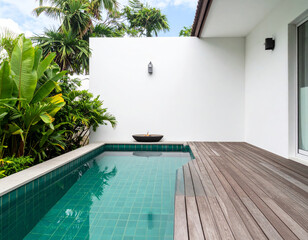 serene pool area featuring modern design with clear blue water pool, surrounded by lush greenery and wooden decking. tranquil atmosphere invites relaxation and enjoyment