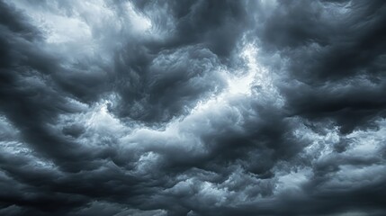 Obraz premium Dramatic storm clouds dark gray and blue swirling sky texture
