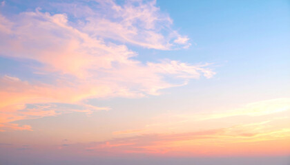 Fototapeta premium beautiful sunset sky with pastel clouds creates serene atmosphere, showcasing soft hues of pink and blue. tranquil scene evokes sense of peace and wonder