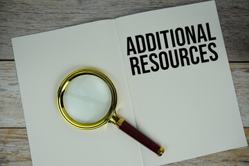 Additional Resources text written on chalkboard with alarm clock on wooden background