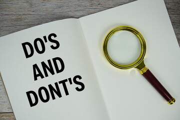 Do's And Dont's text written on chalkboard with alarm clock on wooden background
