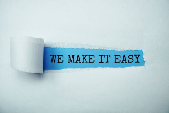Naklejki We Make It Easy message written on blue paper with torn paper background