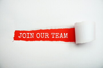 Join Our Team message written on red paper with torn paper background