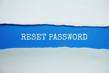 Reset Password message written on blue paper with torn paper background