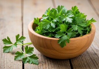 Fresh parsley in wooden bowl on rustic wood surface for cooking and garnish