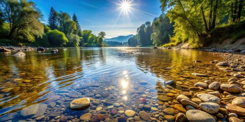 Obraz premium River Scene with Clear Water and Pebbles, sunlight, outdoor photography, sunlight, outdoor photography