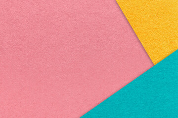 Texture craft dark pink paper background with yellow and cyan border. Vintage abstract rose cardboard.