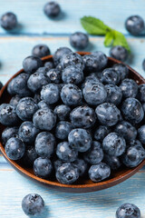 fresh blueberry fruit on woooden table.