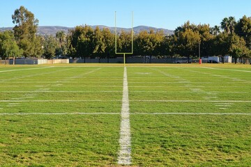 Obraz premium Empty football field under clear sky