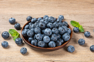 fresh blueberry fruit on woooden table.