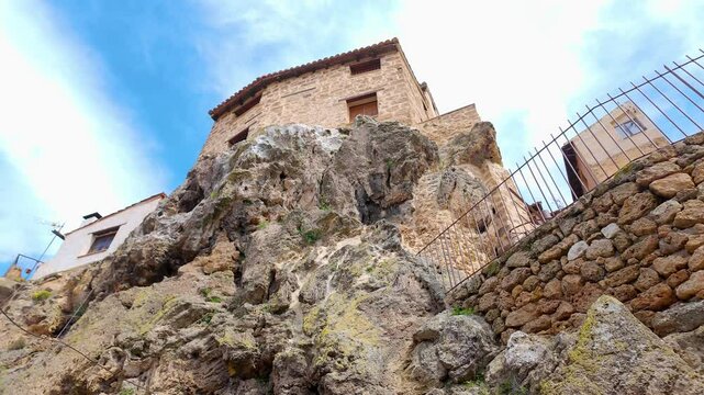 Houses hanging on the rocks of the hill in the village of Beceite, Teruel, Aragon.