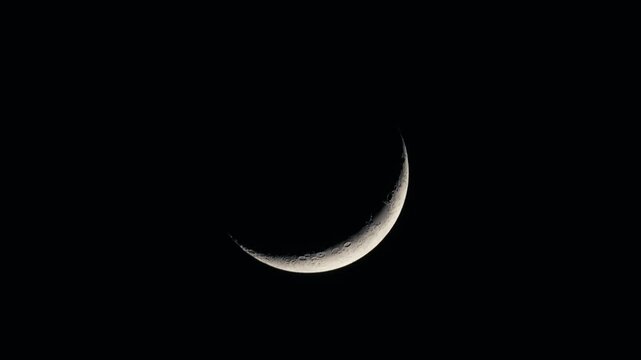 Night Sky with Waxing Crescent Moon and Visible Craters