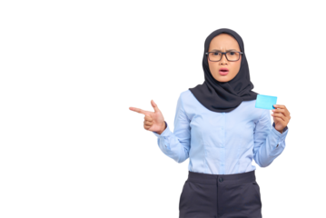Portrait of shocked young Asian woman pointing fingers at copy space and holding credit card isolated on transparent background