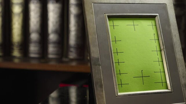 Slide shot reveals blank photo frame Mock-up in vintage home library CLOSE-UP