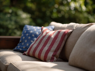 Cozy outdoor couch with flag themed pillows in sunny garden setting