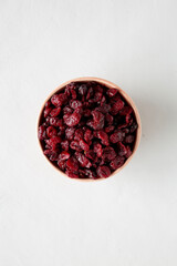 Organic Dried Cranberries in a Bowl, top view. Flat lay, overhead, from above.