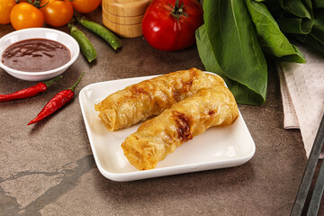 Vietnamese stuffed spring roll served sauce