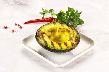 Sliced fresh avocado on the grill