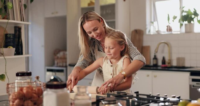 Rolling, mother and girl in kitchen, baking and bonding together with ingredients, recipe and teaching. Parent, happy family and mama with daughter, home and learning with support, child and cooking