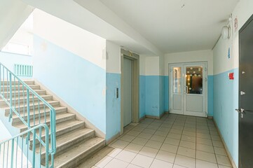 interior apartment public place, house entrance. doors, walls, staircase corridors. staircase in a...