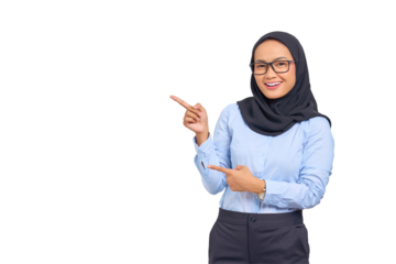 Portrait of smiling young Asian woman pointing finger at copy space isolated on transparent background
