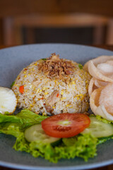 Indonesian fried rice, captured on May 6, 2025. A flavorful stir-fried rice dish with sweet soy sauce, garlic, chili, and traditional spices, served with egg and savory side dishes