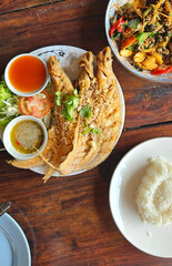 Deep fried fish serving with spicy dipping sauce