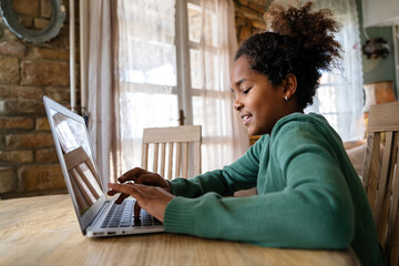 African girl student watching video course, distance e-learning, studying with online teacher
