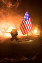 A tabletop diorama of a tragic California wildfire, set in Pacific Palisades near Malibu. Dramatic flames and smoke rise as firefighters battle the blaze