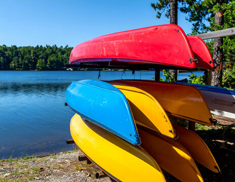 Colorful Canoes Stored By Lake