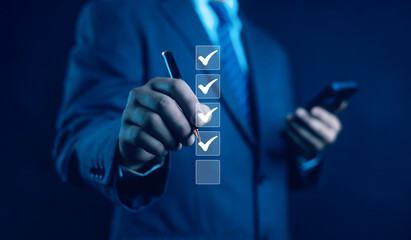 Business Performance Checklist Businessman Using Laptop Doing Online Checklist Survey On Computer...