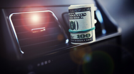 Concept background. dollars with a car key lie in inside cars. financial concept
