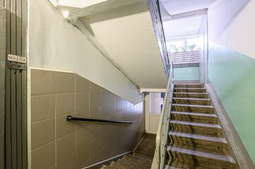 interior apartment public place, house entrance. doors, walls, staircase in a building, concrete...