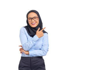 Portrait of smiling young Asian woman pointing finger at copy space isolated on transparent background