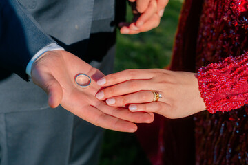 Hands Exchanging Wedding Ring During Ceremony
