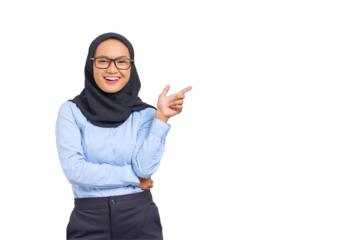 Portrait of smiling young Asian woman pointing finger at copy space isolated on transparent background
