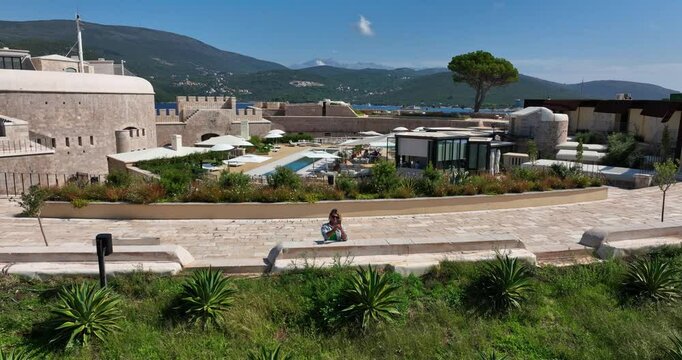 Woman Takes Pictures of View From the Mamula Island hotel, Aerial Shot