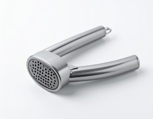 Shiny, metallic kitchen gadget for pressing cloves. It features a perforated pressing surface and ergonomic handles