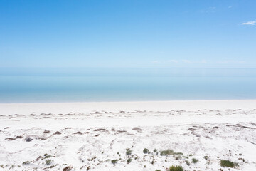 white sandy beach with blue water